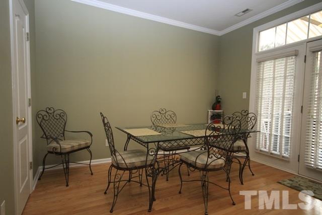 1439 Basinger Court Raleigh, NC 27612 - Photo 10 of 25 a view of a dining room with furniture and wooden floor