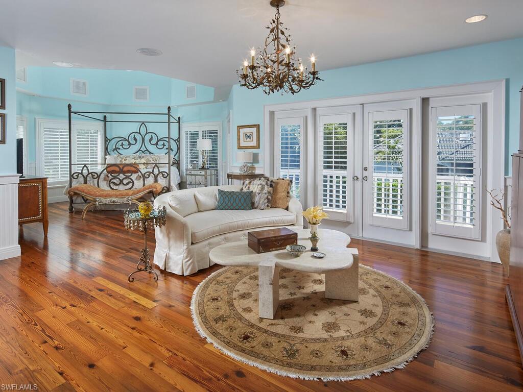 2750 Treasure Lane Naples, FL 34102 - Photo 12 of 28 a living room with furniture and a large window