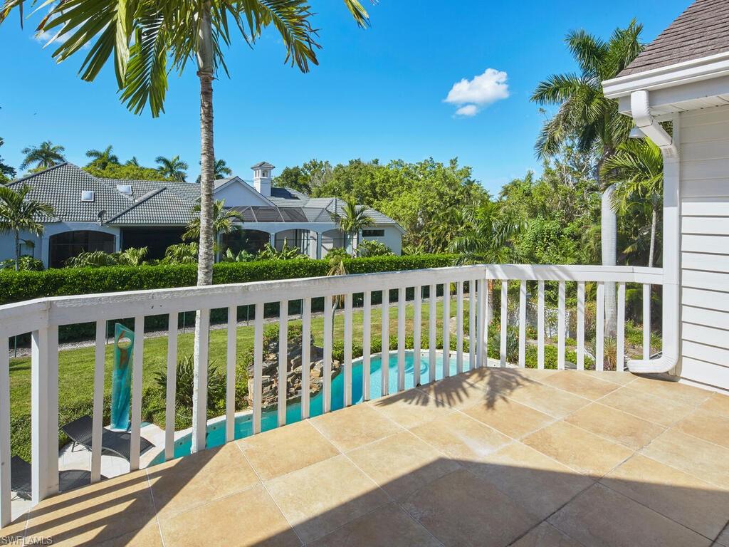 2750 Treasure Lane Naples, FL 34102 - Photo 16 of 28 a view of a balcony with potted plants
