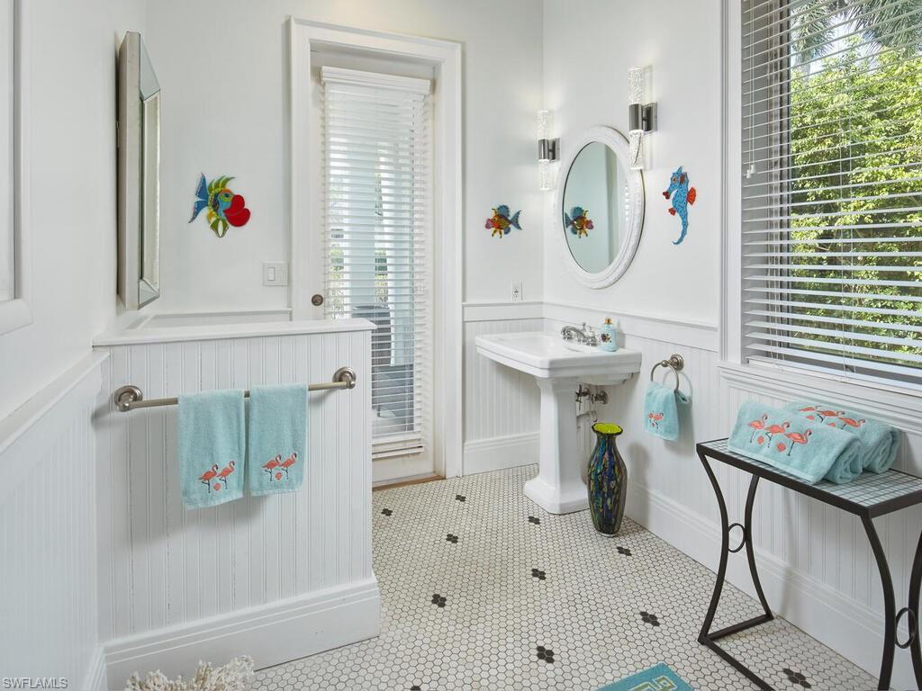 2750 Treasure Lane Naples, FL 34102 - Photo 24 of 28 a bathroom with a sink mirror and window