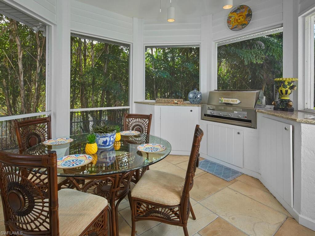 2750 Treasure Lane Naples, FL 34102 - Photo 26 of 28 a dining room with furniture and window