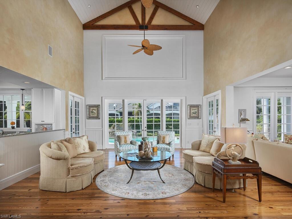 2750 Treasure Lane Naples, FL 34102 - Photo 5 of 28 a living room with furniture and a large window