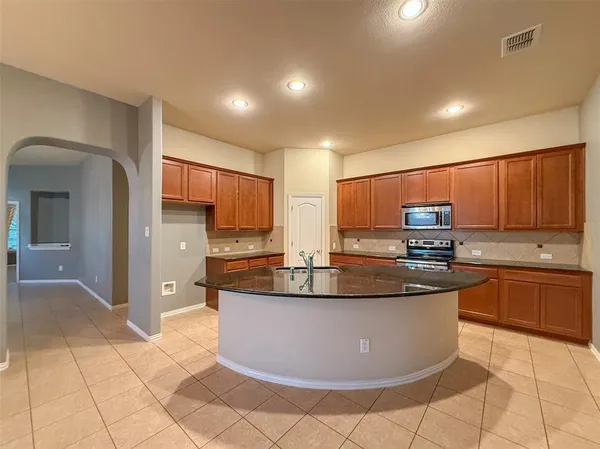 a room with furniture and a flat screen tv