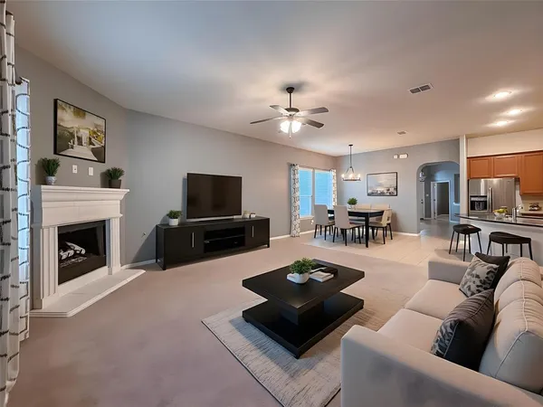 a view of an empty room with a fireplace