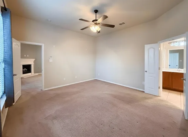 a bathroom with a tub a sink and a mirror