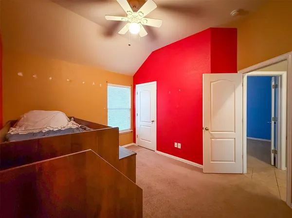 a room with furniture and a potted plant