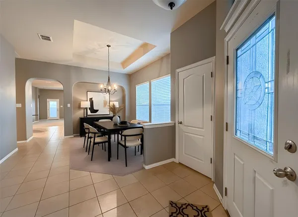 a dining room with furniture and window