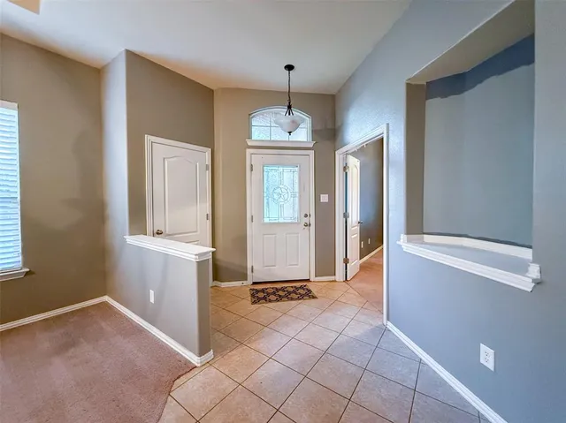 a work room with furniture and a bookshelf