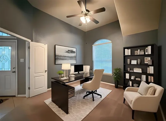 a view of an empty room and a ceiling fan