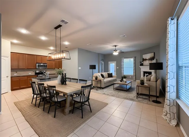 a large kitchen with kitchen island granite countertop a stove and a sink with granite countertops