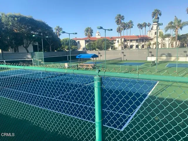 a swimming pool with outdoor seating and yard