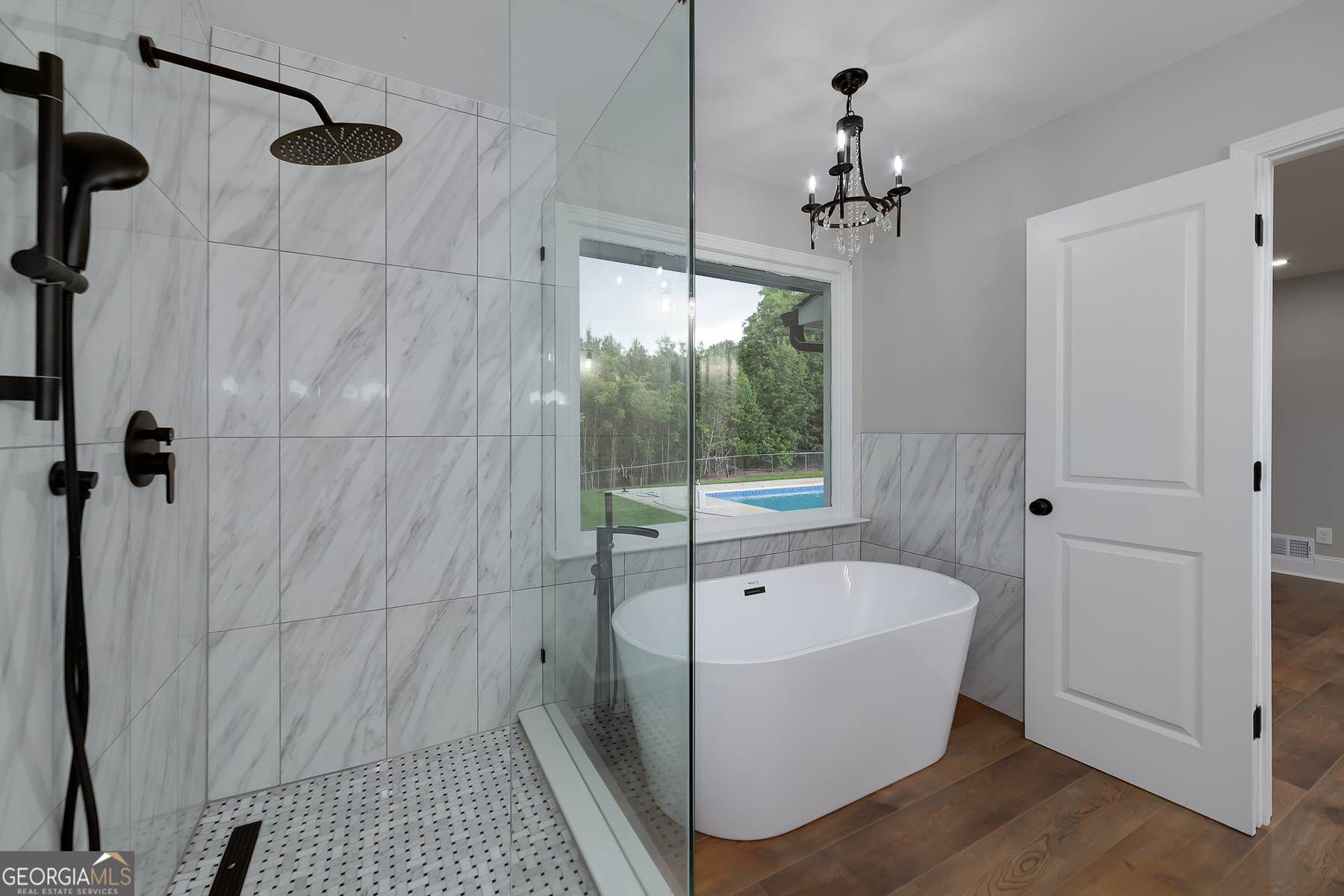 858 Pates Creek Road Stockbridge, GA 30281 - Photo 15 of 27 a bathroom with a bathtub and shower