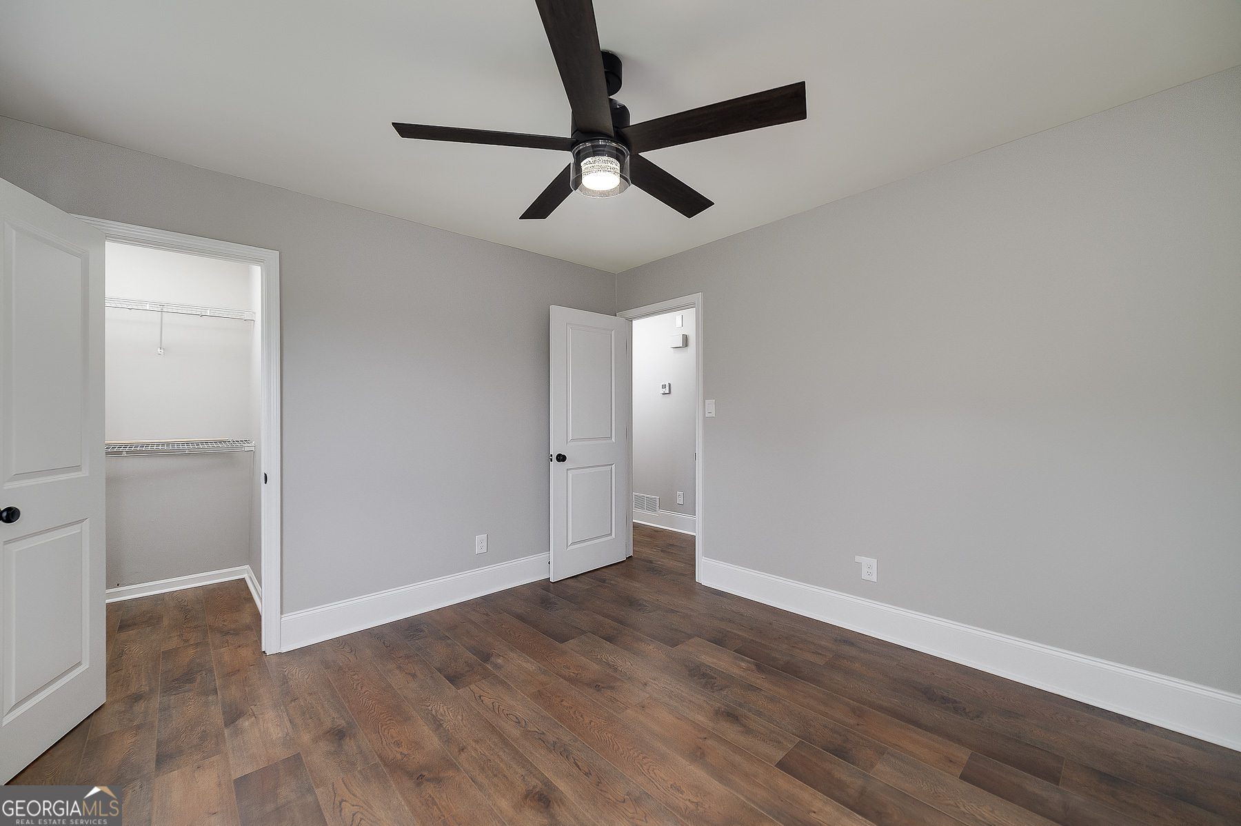 858 Pates Creek Road Stockbridge, GA 30281 - Photo 20 of 27 wooden floor in an empty room