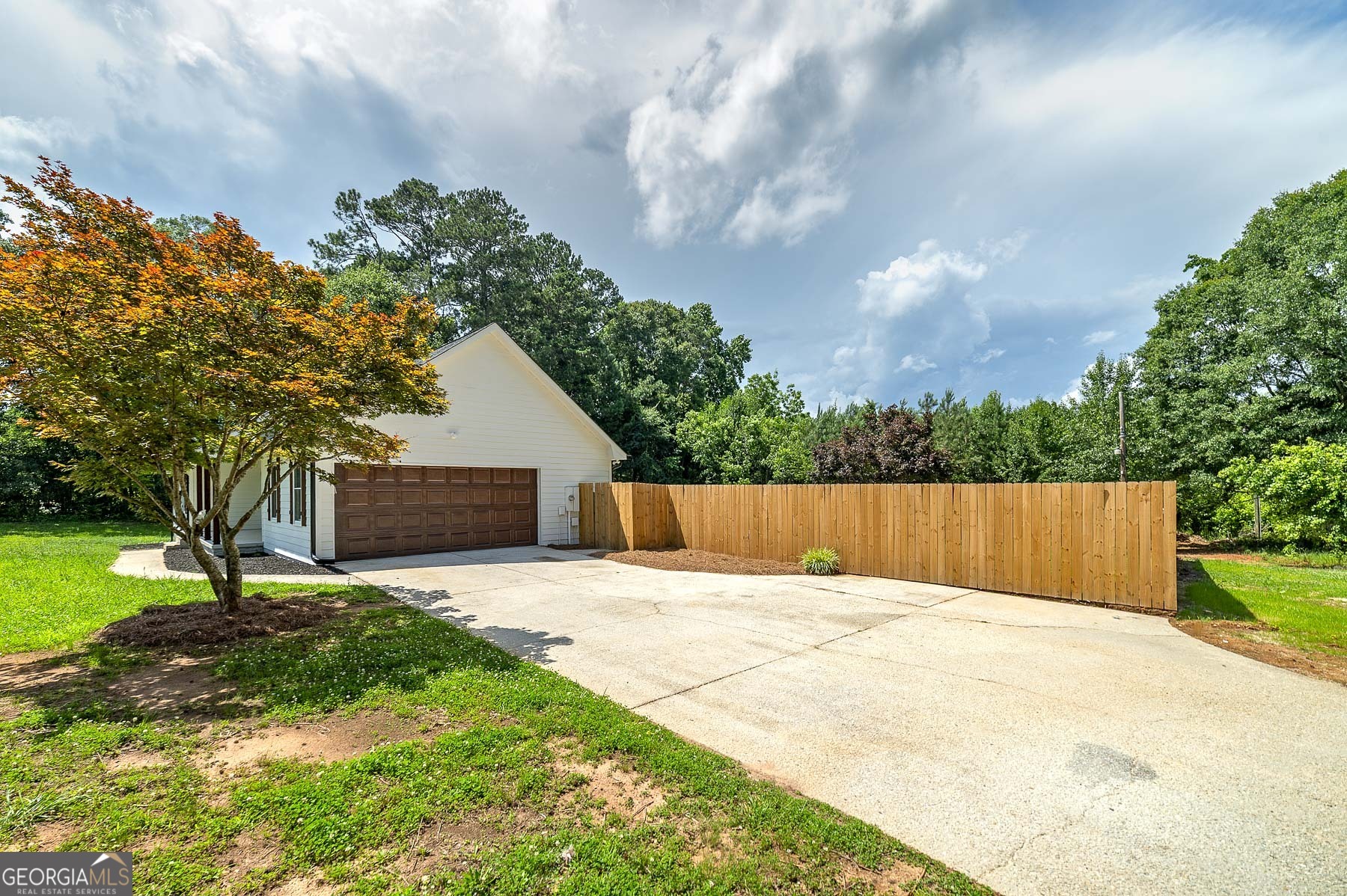 858 Pates Creek Road Stockbridge, GA 30281 - Photo 2 of 27 a view of house with backyard and a garden