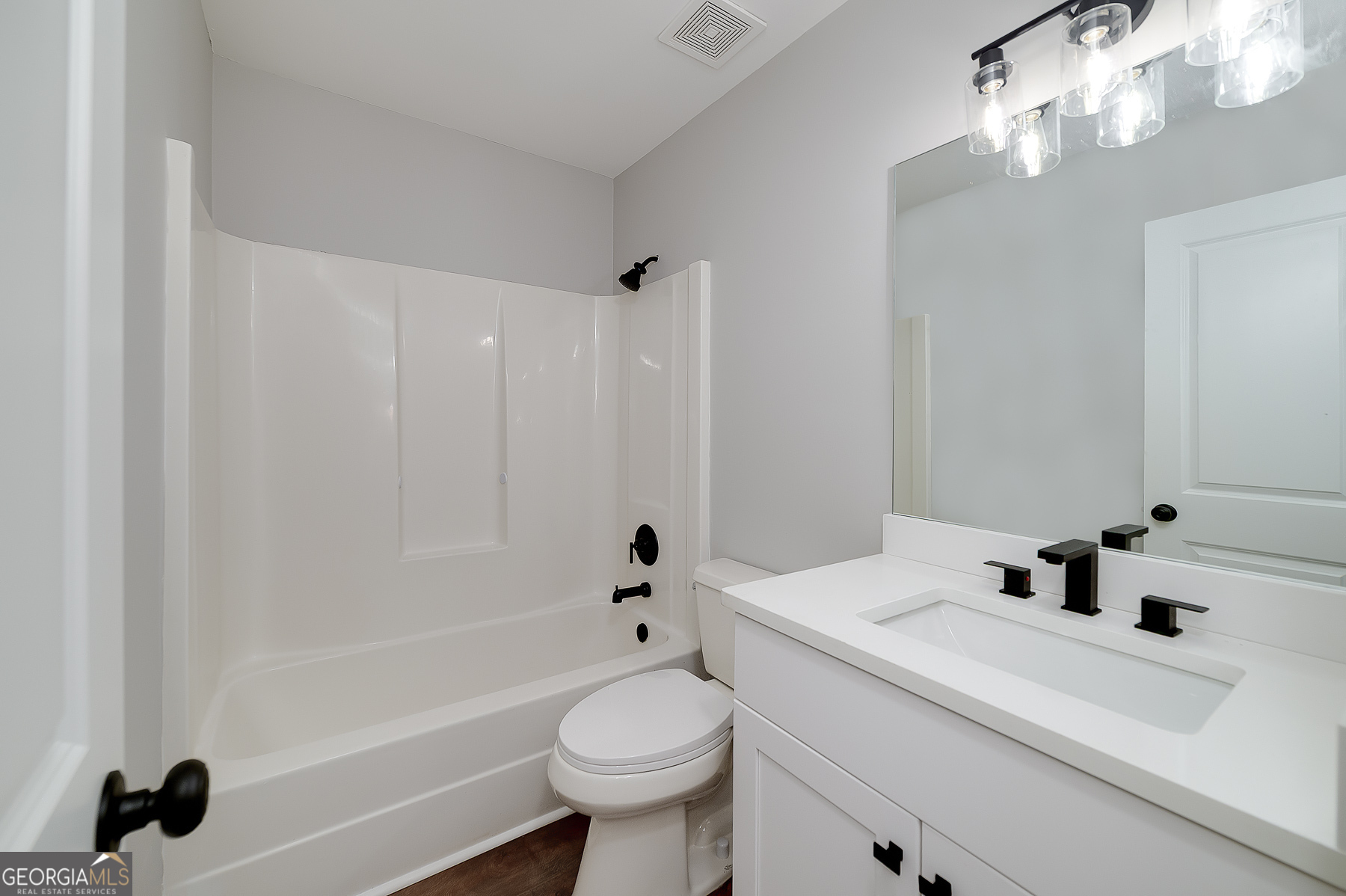 858 Pates Creek Road Stockbridge, GA 30281 - Photo 21 of 27 a bathroom with a sink a toilet and shower