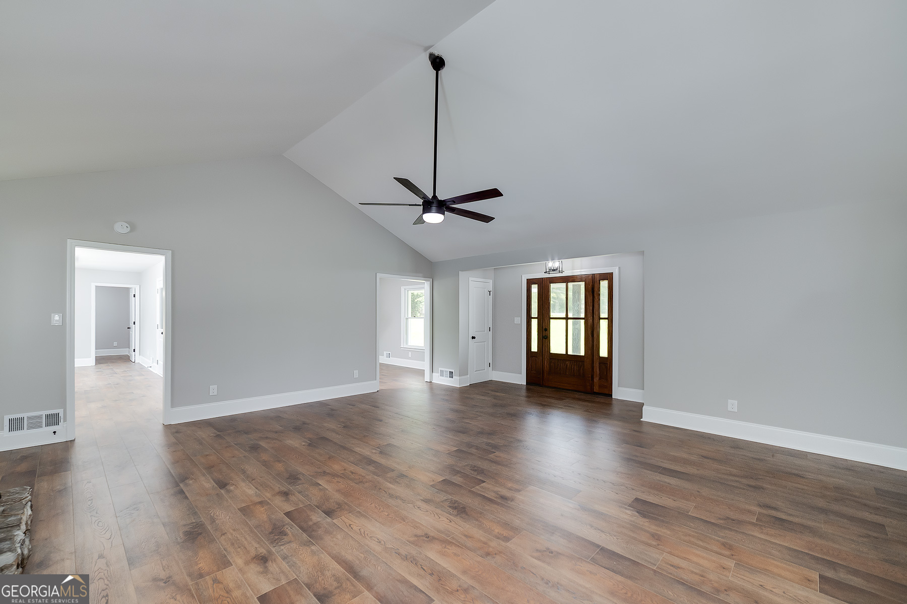 858 Pates Creek Road Stockbridge, GA 30281 - Photo 5 of 27 a view of an empty room with wooden floor and a window