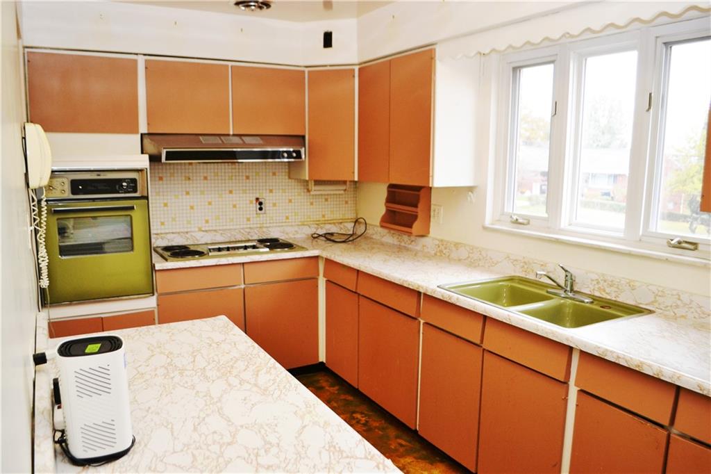 103 Lincoln Road Clairton, PA 15025 - Photo 15 of 39 a kitchen with a refrigerator sink and cabinets