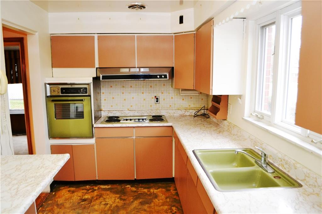 103 Lincoln Road Clairton, PA 15025 - Photo 17 of 39 a kitchen with a sink stove and refrigerator