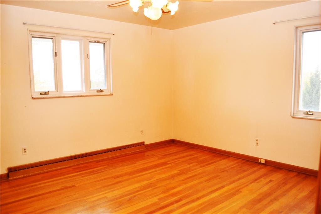 103 Lincoln Road Clairton, PA 15025 - Photo 19 of 39 an empty room with wooden floor and windows