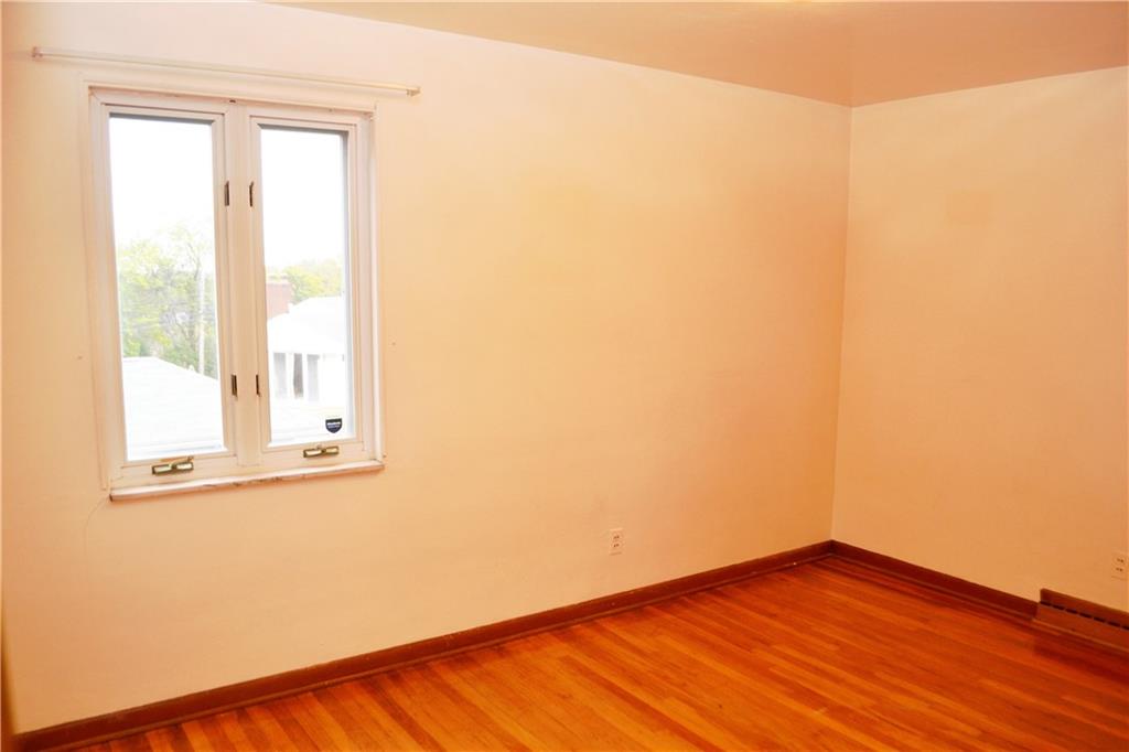 103 Lincoln Road Clairton, PA 15025 - Photo 25 of 39 a view of an empty room with wooden floor and a window