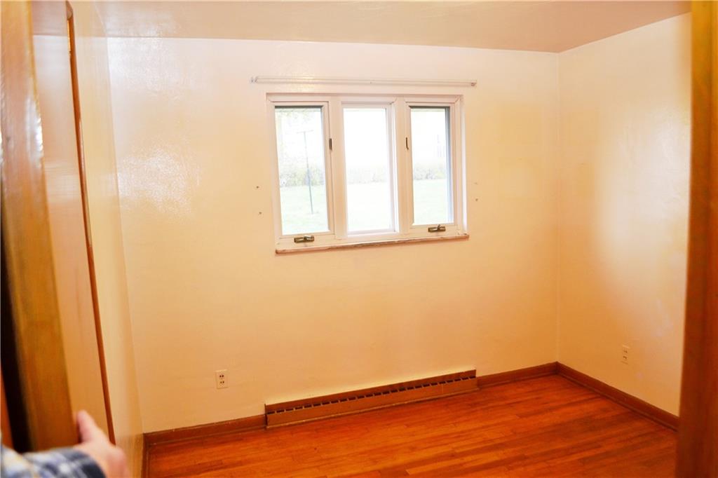 103 Lincoln Road Clairton, PA 15025 - Photo 29 of 39 an empty room with wooden floor and windows