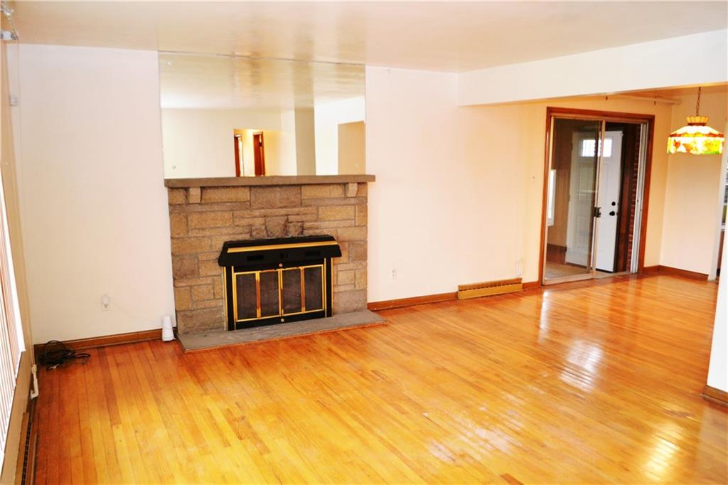 103 Lincoln Road Clairton, PA 15025 - Photo 9 of 39 a view of empty room with wooden floor and fireplace