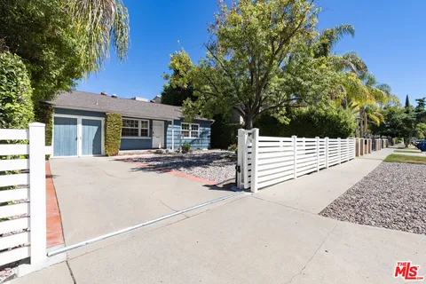 a side view of a house with a garage