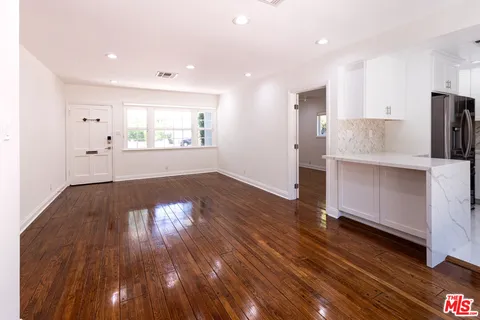 a view of kitchen and wooden floor