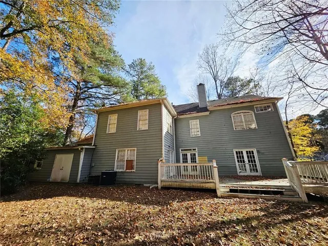 a view of backyard space and trees