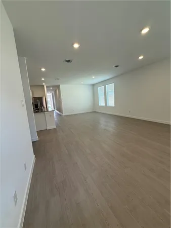 a view of kitchen with refrigerator stove and kitchen view