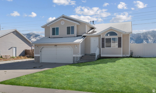 1292 Cedarwood Road Tooele, UT 84074 - Photo 1 of 1 Split level home featuring a mountain view