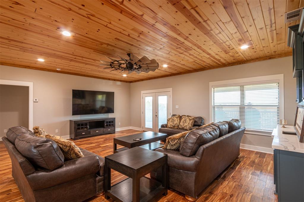79 West Highway 79 Franklin, TX 77856 - Photo 18 of 38 a living room with furniture and a flat screen tv