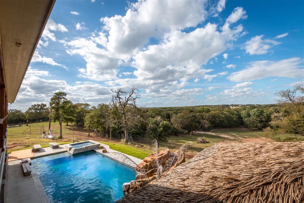 79 West Highway 79 Franklin, TX 77856 - Photo 19 of 38 a view of a swimming pool with an outdoor seating and a yard