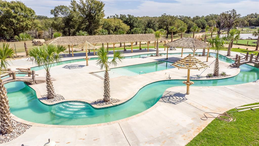 79 West Highway 79 Franklin, TX 77856 - Photo 5 of 38 a view of a swimming pool with a yard