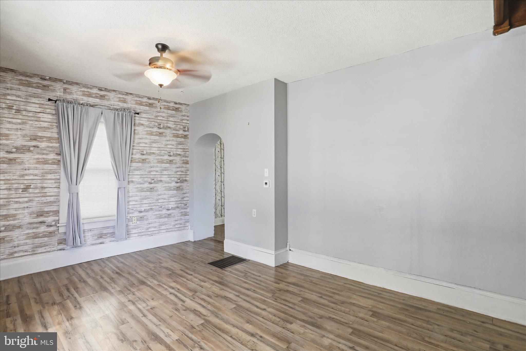 21 Sharpless Street Keyser, WV 26726 - Photo 4 of 33 a view of empty room with wooden floor
