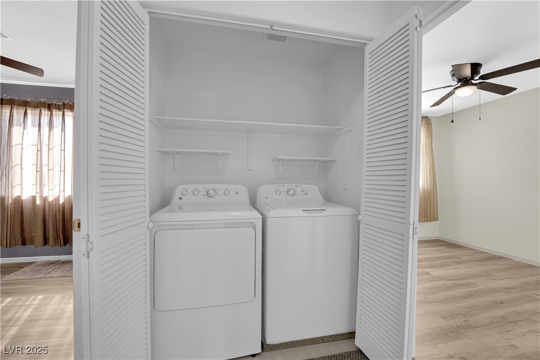 7572 Durham Hall Avenue, Unit 201 Las Vegas, NV 89130 - Photo 21 of 26 Washroom with ceiling fan, light wood-style flooring, and washing machine and dryer