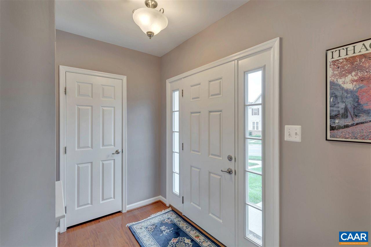 475 Rolkin Road Charlottesville, VA 22911 - Photo 6 of 40 a view of a hallway with wooden floor and closet