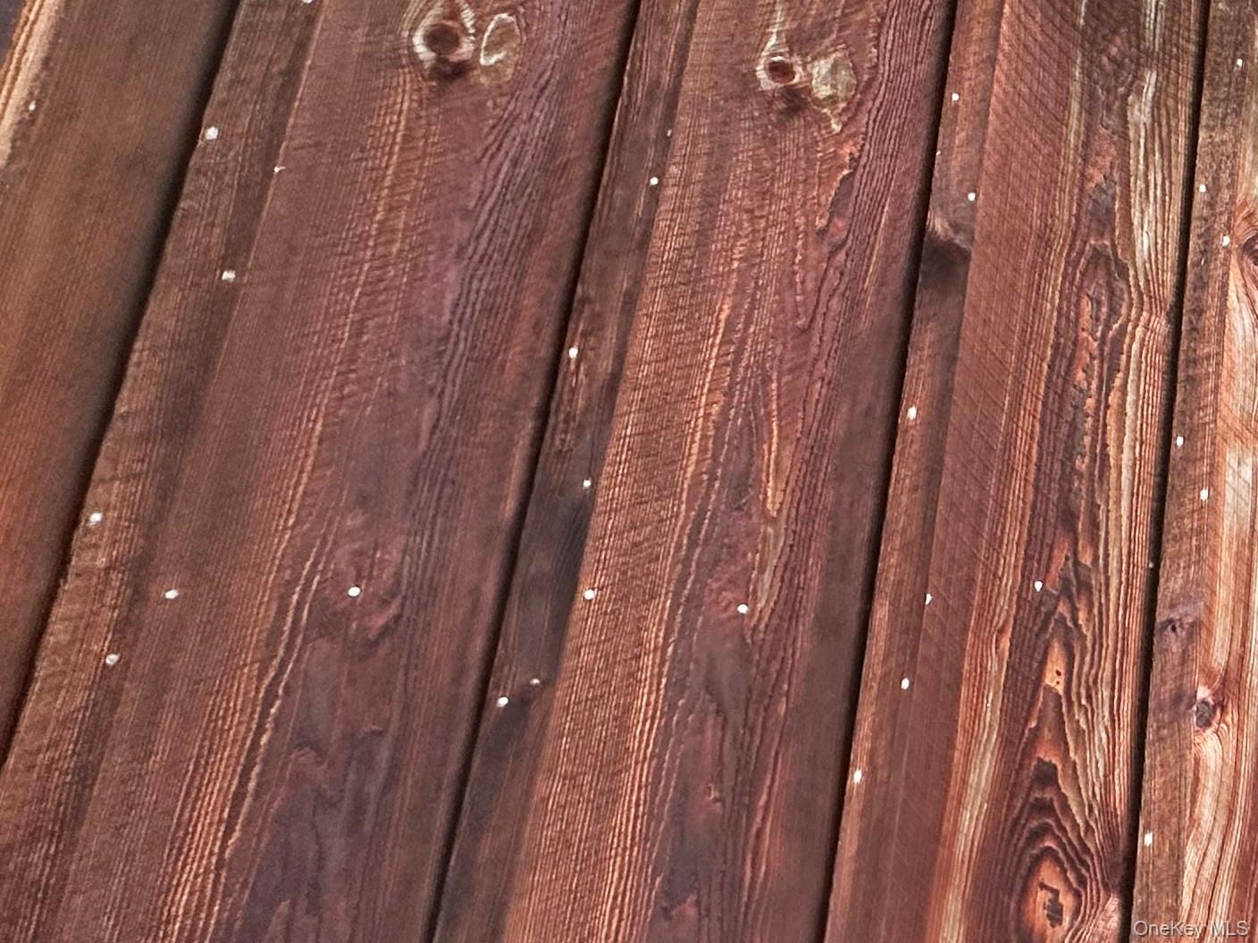 818 Methol Road Roscoe, NY 12776 - Photo 6 of 39 Close-up detail of the board-and-batten hemlock siding showcasing the home’s rustic Catskills craftsmanship and character.
