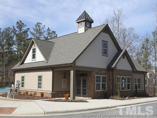 66 Intuition Circle Durham, NC 27705 - Photo 12 of 13 a front view of a house with a yard and garage