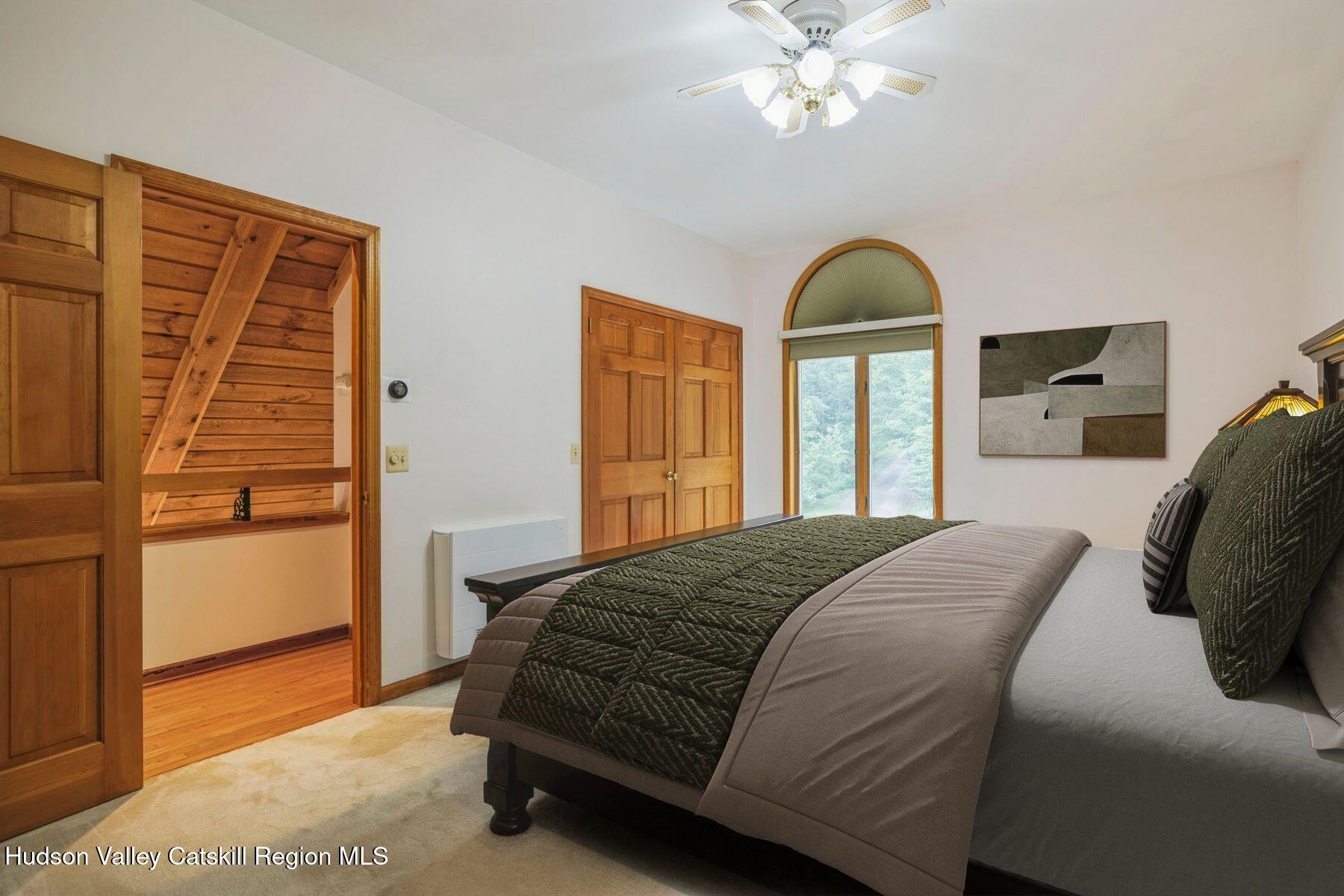 50 Halcott Ridge Road Shandaken, NY 12465 - Photo 19 of 28 a bedroom with a bed and two windows