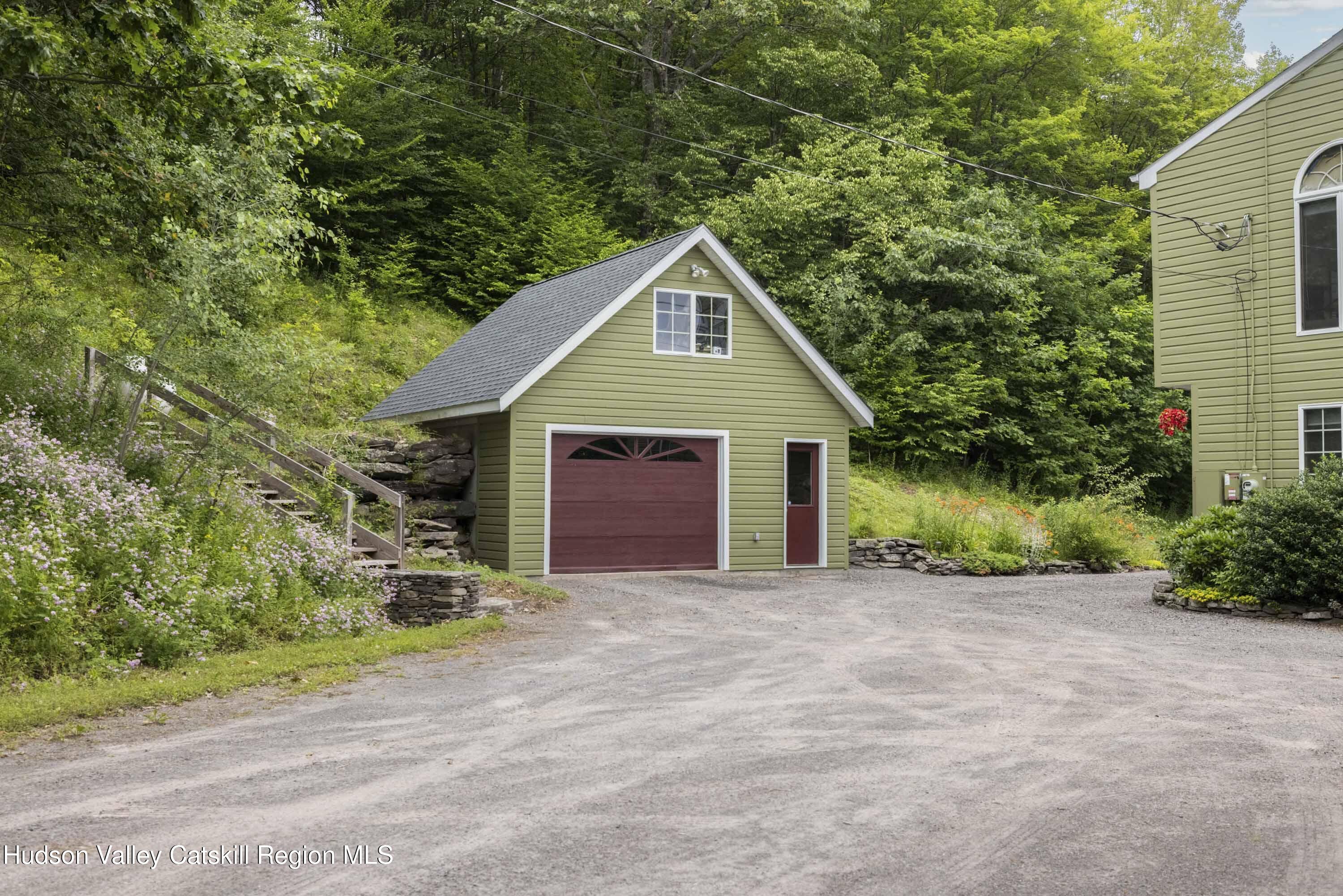 50 Halcott Ridge Road Shandaken, NY 12465 - Photo 25 of 28 a front view of a house with a yard and garage