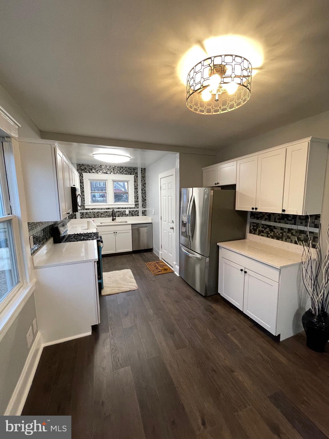 7350 Montgomery Road Elkridge, MD 21075 - Photo 17 of 44 a kitchen with stainless steel appliances a refrigerator and a stove top oven