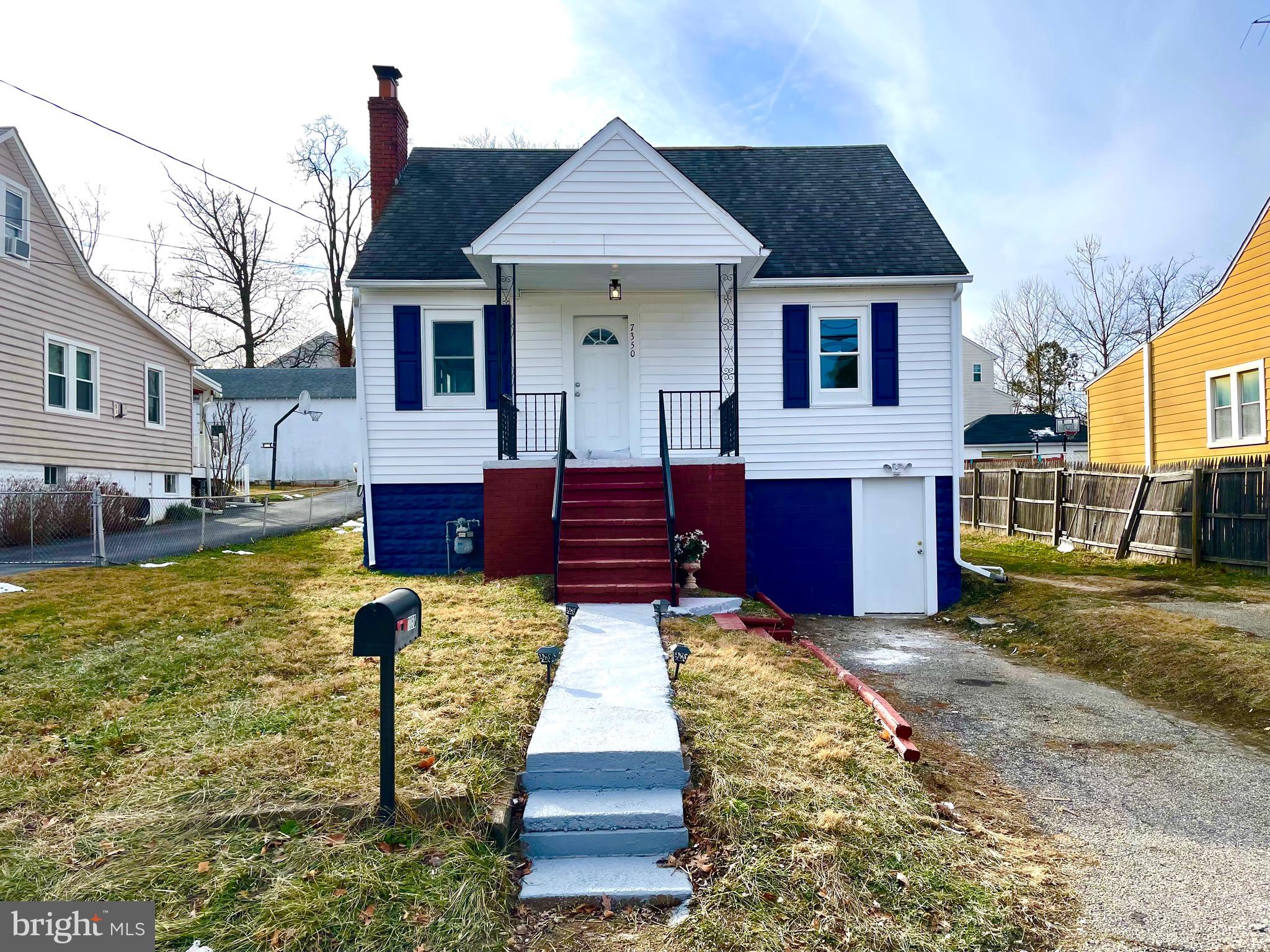 7350 Montgomery Road Elkridge, MD 21075 - Photo 3 of 44 a front view of a house with a yard