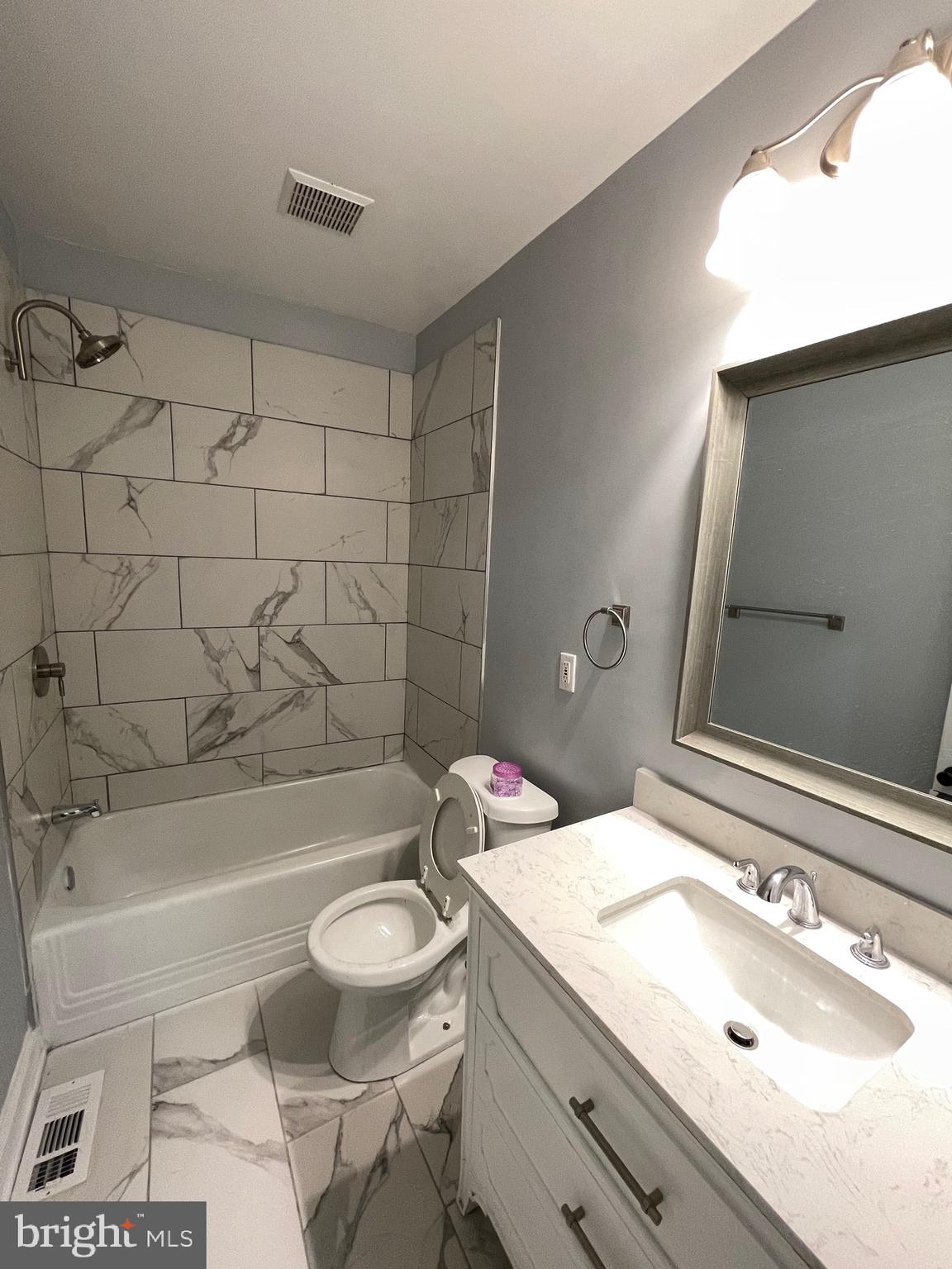 7350 Montgomery Road Elkridge, MD 21075 - Photo 10 of 44 a bathroom with a sink toilet vanity and shower