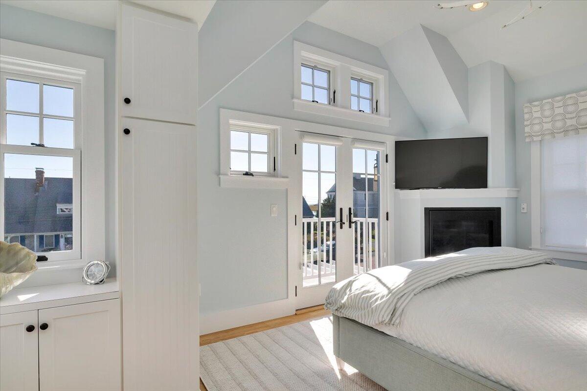 8 Beach View Road West Dennis, MA 02670 - Photo 29 of 81 a bed sitting in a bedroom next to a window with a flat screen tv