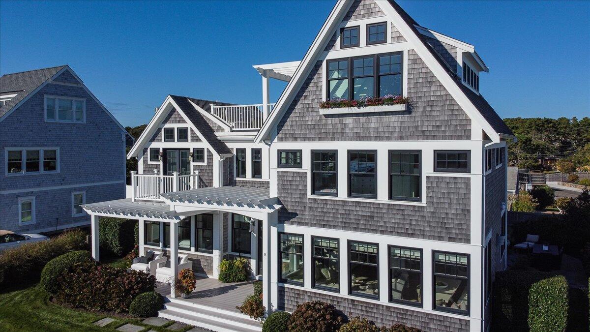 8 Beach View Road West Dennis, MA 02670 - Photo 65 of 81 a front view of a house with a yard
