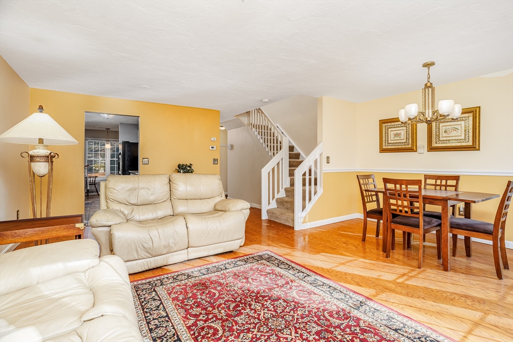 303 Ridgefield Circle, Unit C Clinton, MA 01510 - Photo 11 of 31 a living room with furniture and a wooden floor