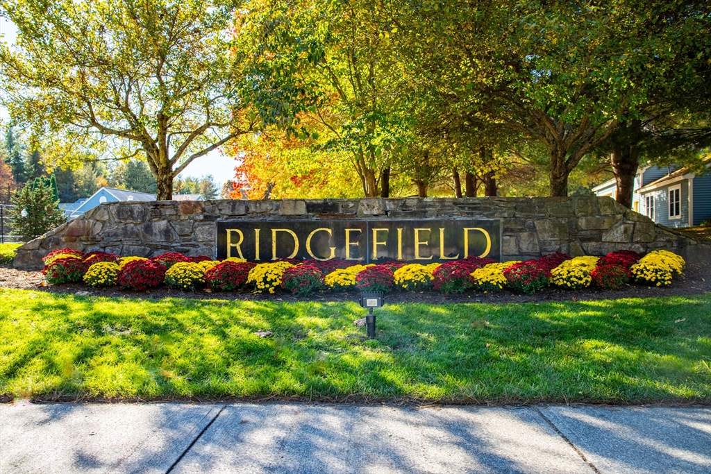 303 Ridgefield Circle, Unit C Clinton, MA 01510 - Photo 26 of 31 a view of a house with a yard