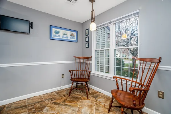 a workspace with furniture and a window