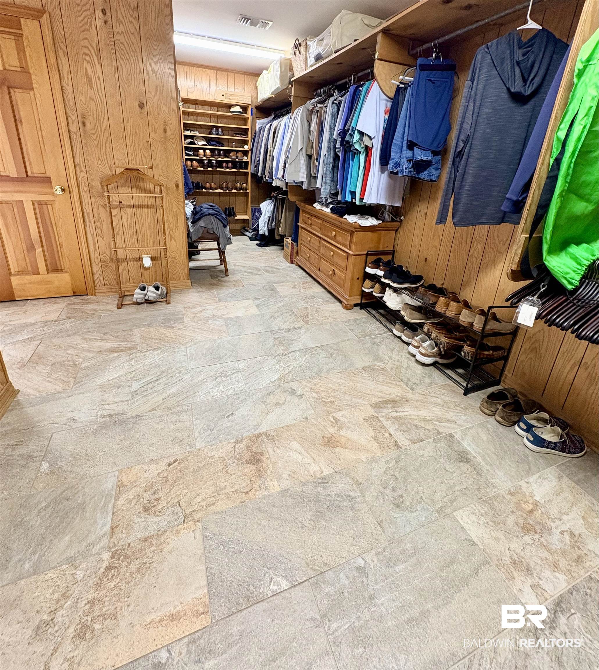44 Ridge Road Castleberry, AL 36432 - Photo 8 of 33 Walk in closet featuring light stone finish flooring
